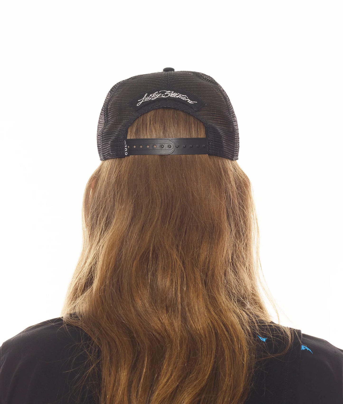 LUCKY BASTARD LOGO TRUCKER HAT IN BLACK