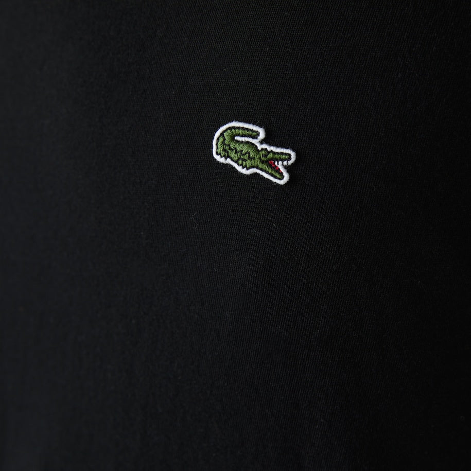Close-up of Lacoste embroidered green crocodile logo on Men's Crew Neck Pima Cotton Jersey T-shirt in vibrant tone