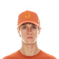 CLEAN LOGO MESH BACK TRUCKER CURVED VISOR IN RUST