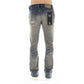 Back view of Cult of Individuality Lenny Bootcut in Cyrus jeans, showcasing the signature Cult XX on the back leg and vintage washed denim with rip detailing for added style