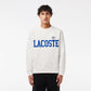 Half-shot featuring Lacoste Men's Flocked Fleece Sweatshirt in white, showcasing the iconic badge and flocked print, crafted from premium organic cotton fleece for everyday comfort