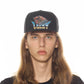 LUCKY BASTARD LOGO TRUCKER HAT IN BLACK
