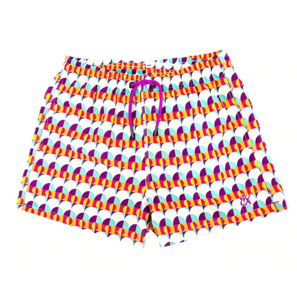 Close-up front view of Sunset Alchemy Swim Trunks, showcasing the vibrant purples, blues, yellows, and pinks inspired by classic LA sunsets, made from 100% polyester with convenient pockets and matching drawstring bag included