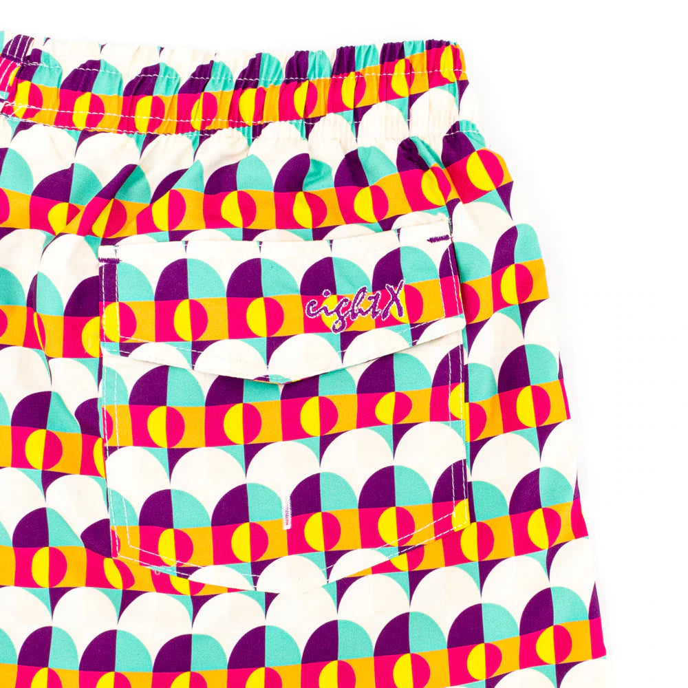 Close-up view of the backside pocket of Sunset Alchemy Swim Trunks, highlighting its functionality and stylish design, perfect for storing essentials while enjoying summer activities